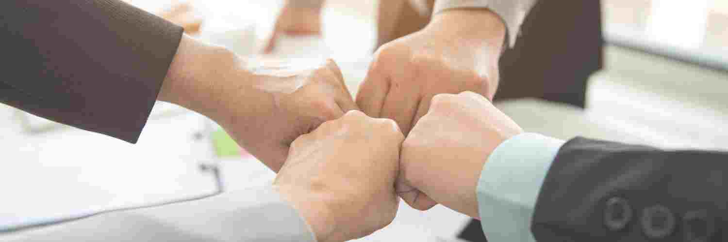 businessmen doing fistbump